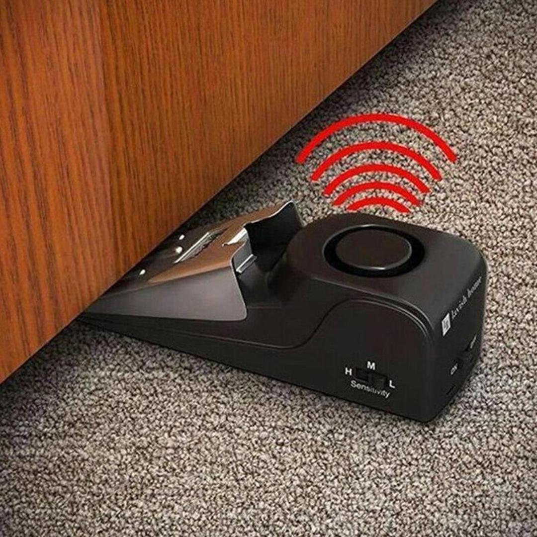 Portable door stop alarm with motion-sensitive siren for entry alert and personal safety for hotels and airbnbs