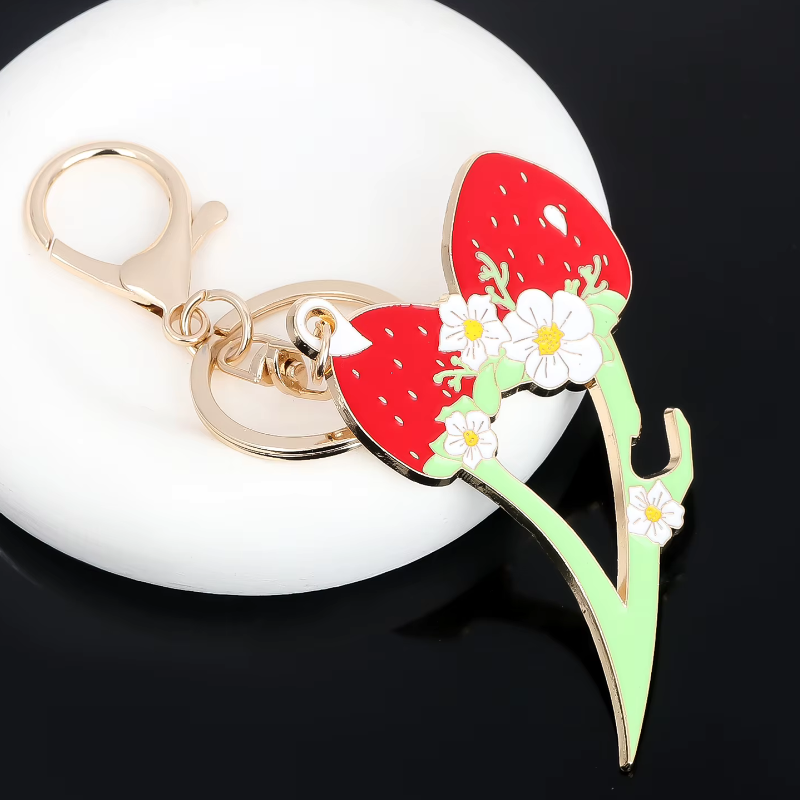 Keychain with strawberry design on a white background